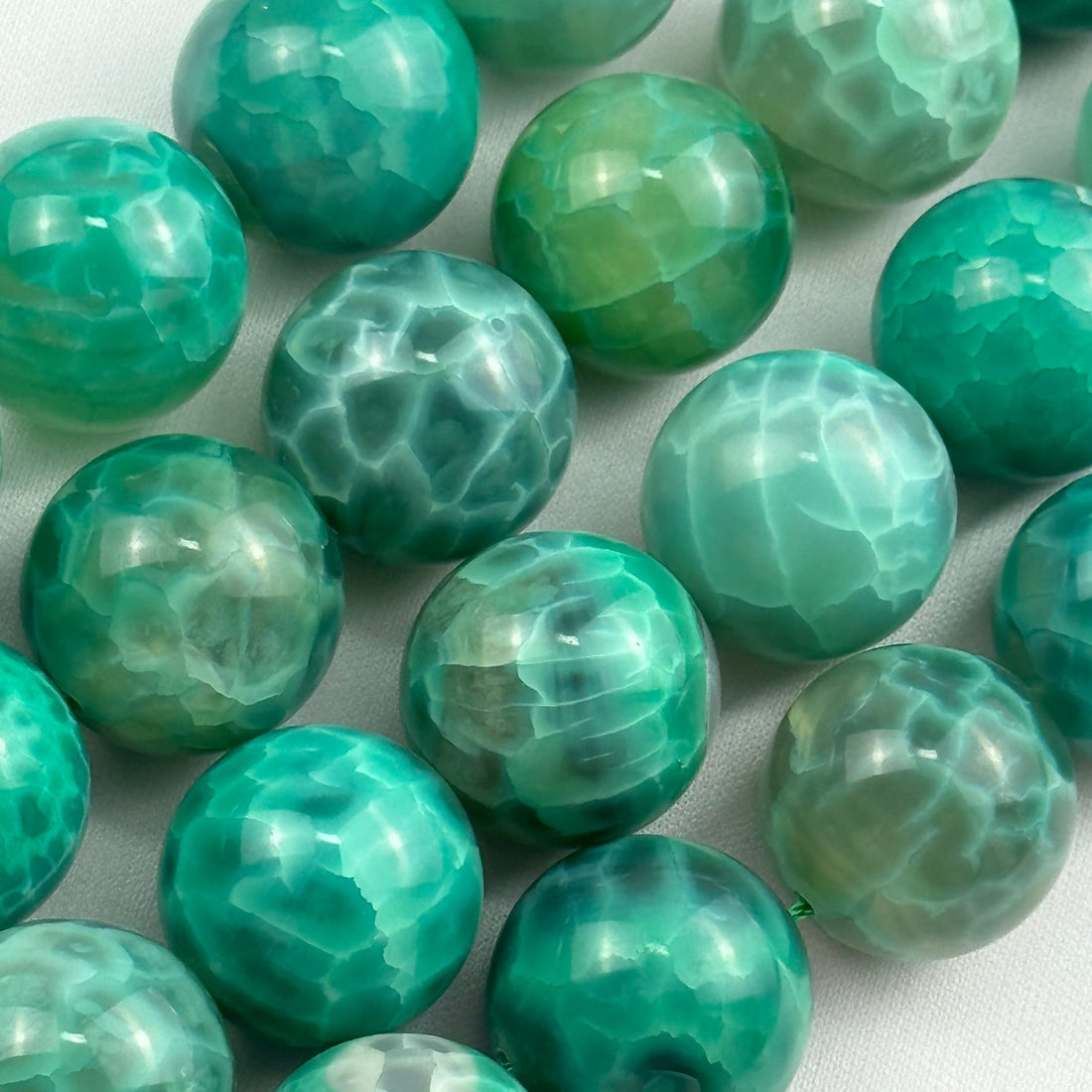 dyed green agate gemstone beads in polished finish and round shape