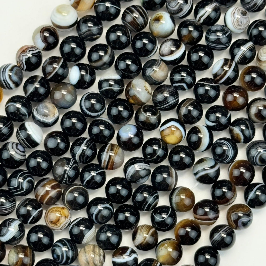 banded agate gemstone beads polished finish and round shape