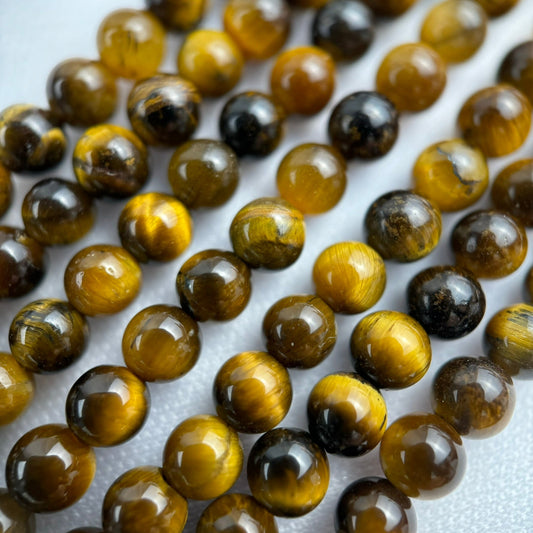 Tiger's eye gemstone - real one in beaded round shape and polished finish