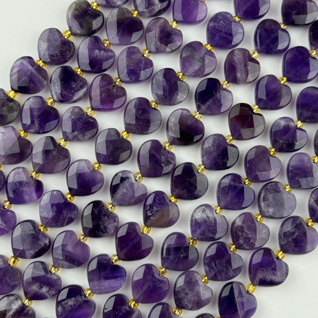February birthstone - amethyst in heart shape and faceted finish