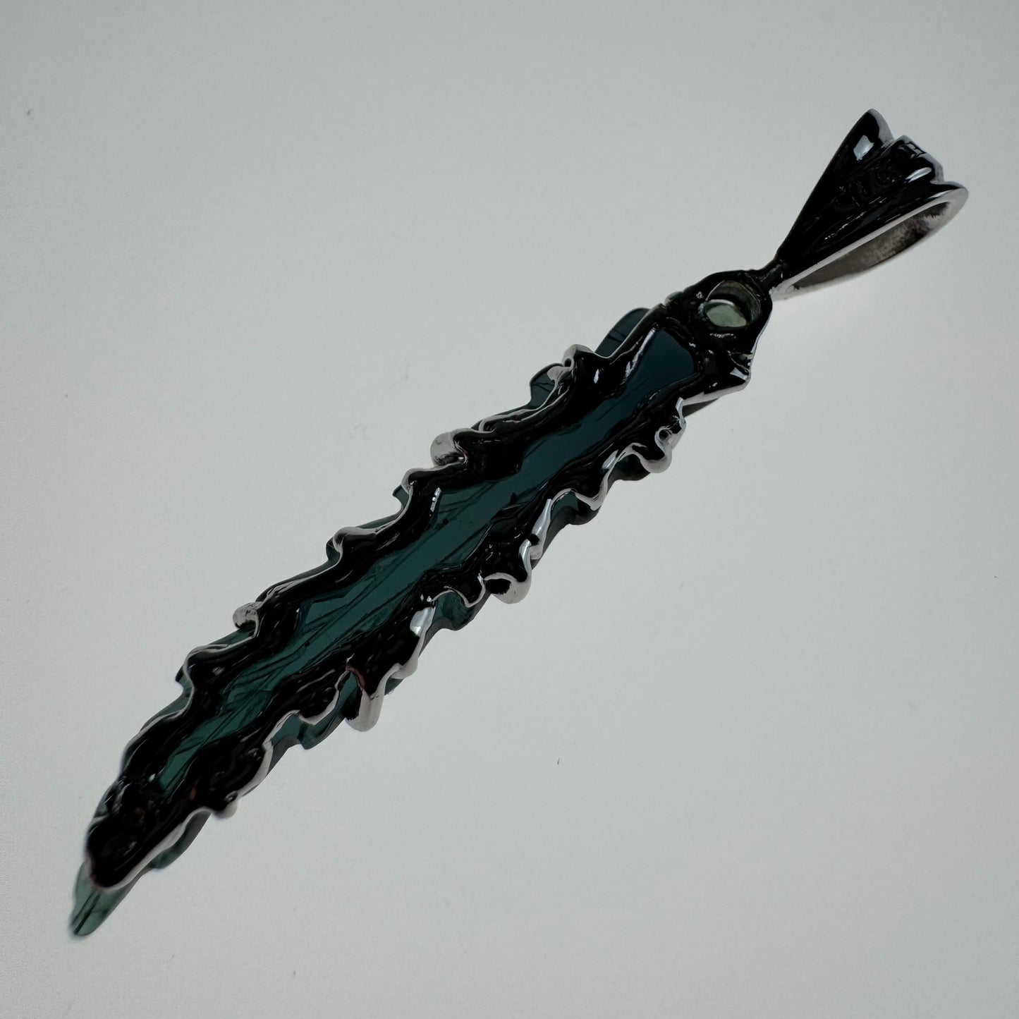 Hand carved blue Tourmaline earring from Brazil, set in sterling silver 925