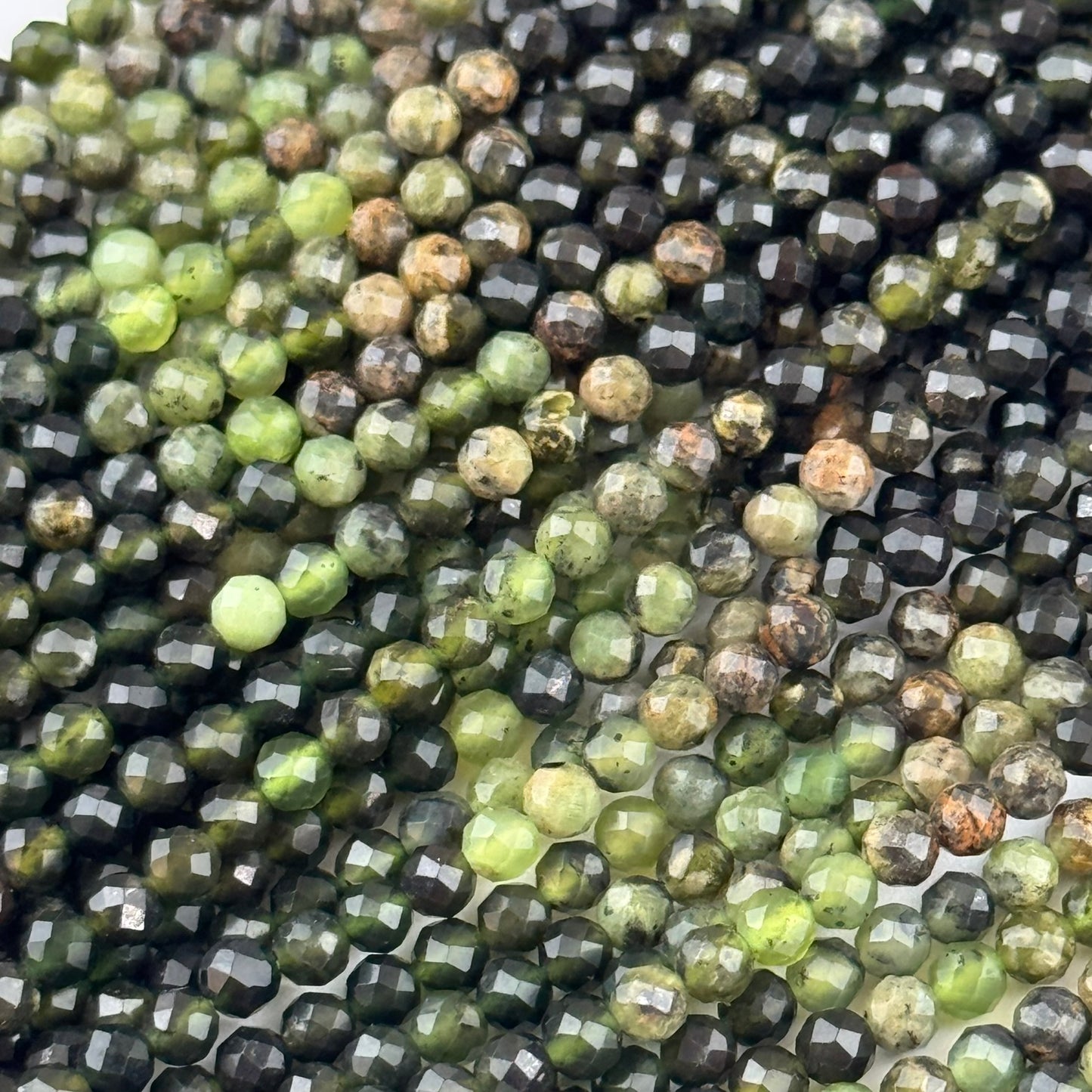 Serpentine Faceted Round Beads - (A Quality)