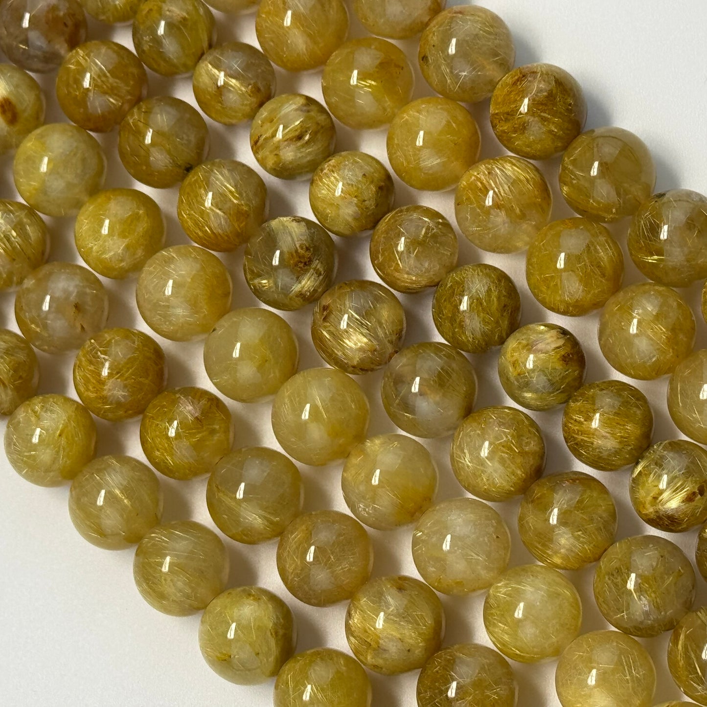 Golden Rutilated Quartz Polished Round Beads (AAAA Quality)