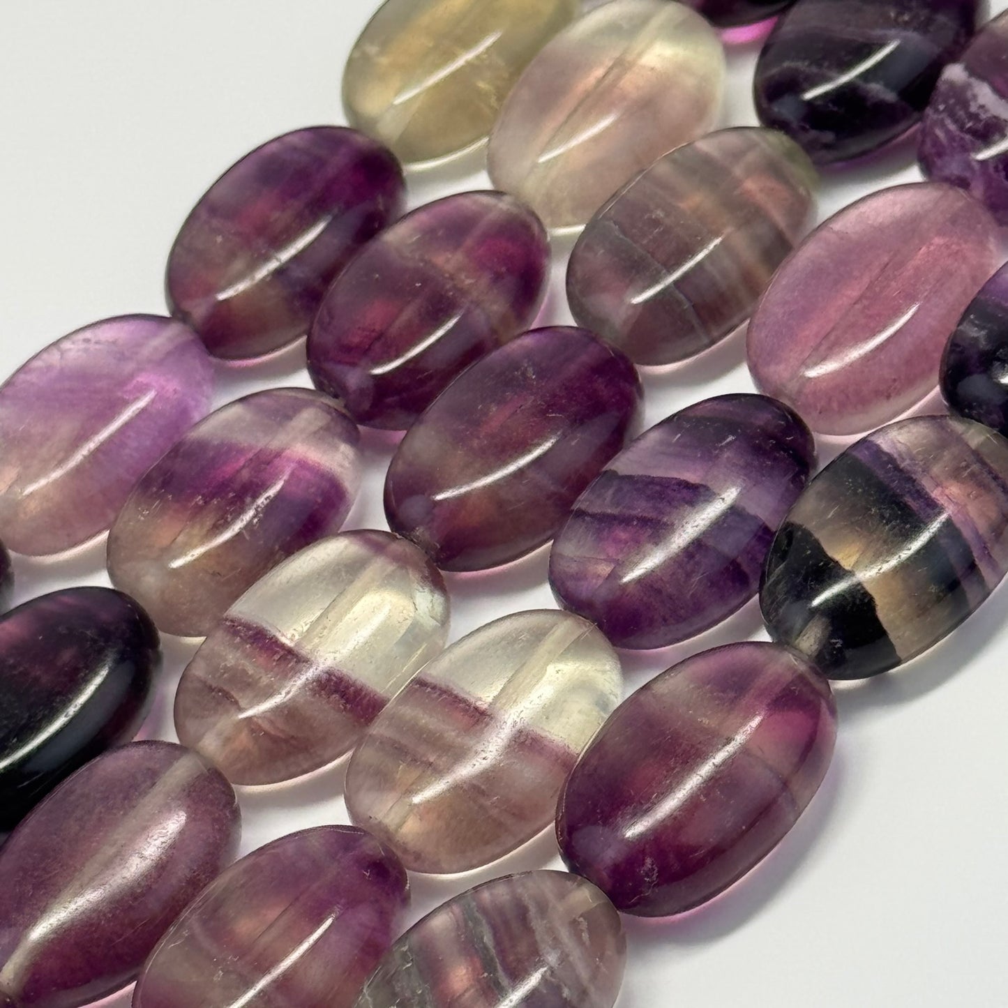 Rainbow Fluorite Polished Oval Gemsotne Beads - Purple Based