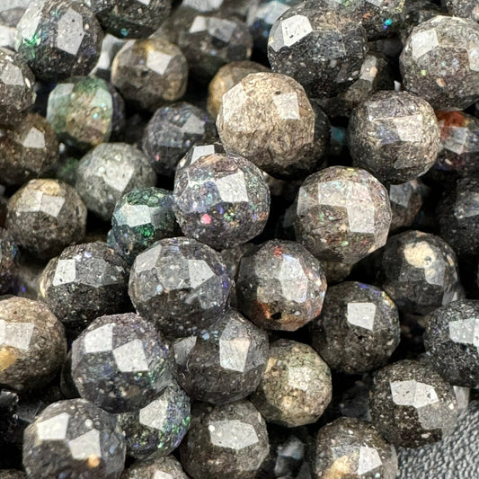 Black opal faceted round gemstone beads displaying vibrant color play