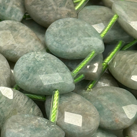amazonite - in close up image with faceted finish and pear shape - all in strands of beads