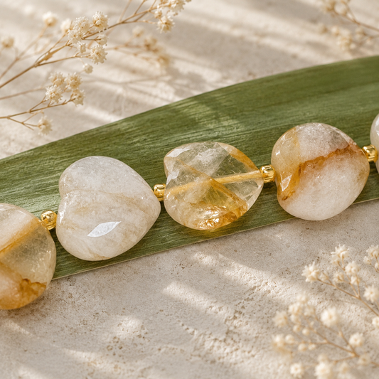 Various natural quartz gemstones including amethyst, citrine, rose quartz, smoky quartz, and clear quartz