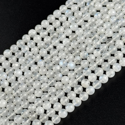 AAAA+ quality polished rainbow moonstone round gemstone beads displaying natural blue adularescence