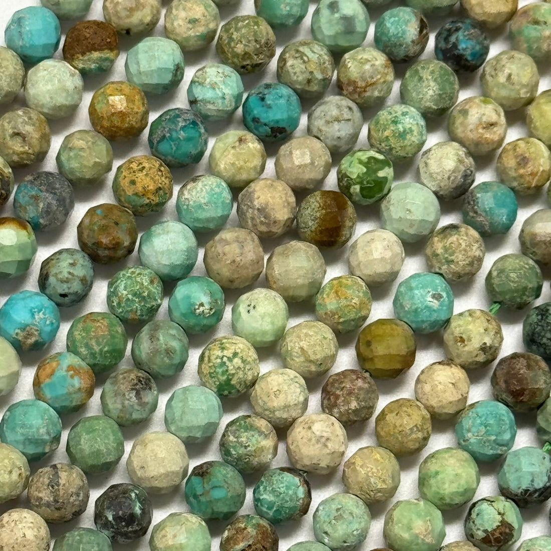 A quality faceted round turquoise gemstone beads for bracelet making and custom jewelry