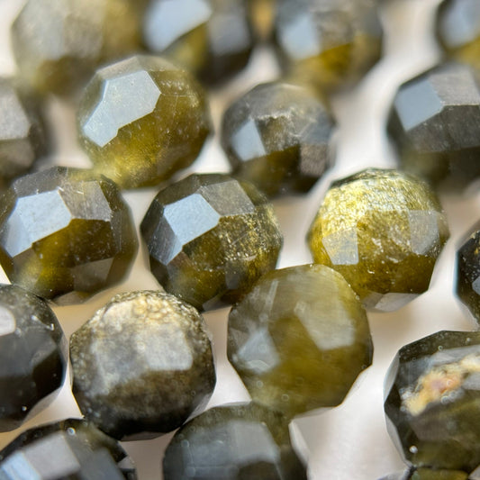 Gold sheen obsidian faceted round beads displaying natural golden reflections