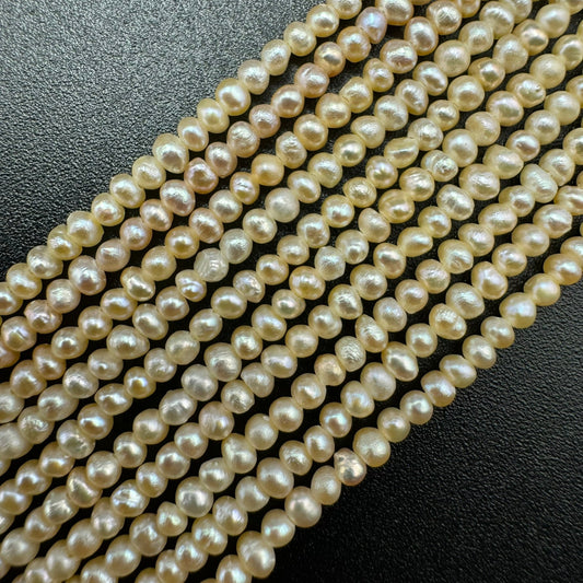 Real freshwater cultured pearls showing natural luster, subtle surface characteristics, and variations in shape.
