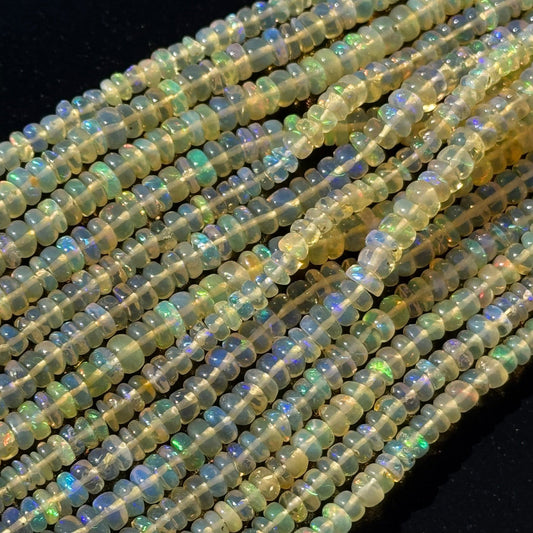Australian and Ethiopian natural opals displaying different body tones, transparency and colorful play-of-color.