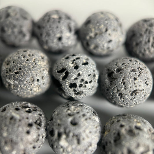 Unwaxed black lava stone round beads with natural volcanic texture