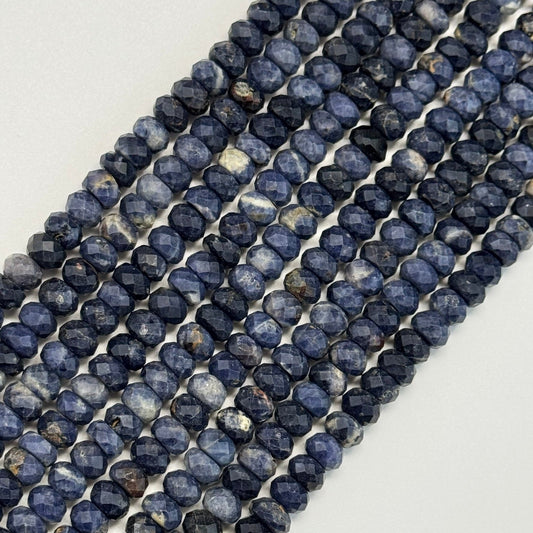 Blue sapphire faceted rondelle beads arranged for luxury jewelry making