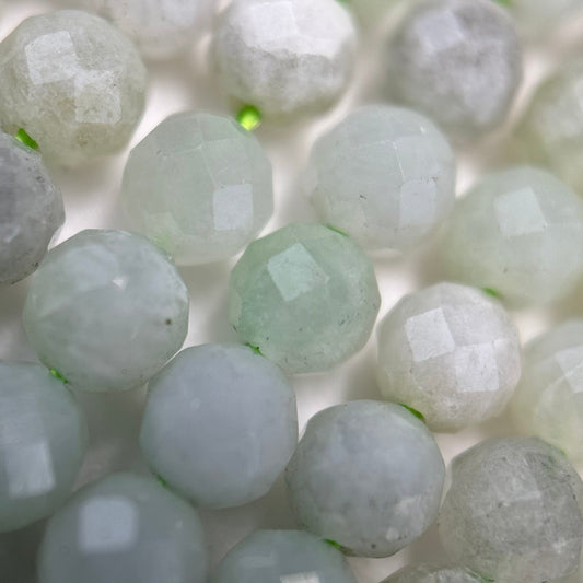 Selection of natural jade beads in round, faceted, and rondelle shapes for handmade jewelry and bracelet making.