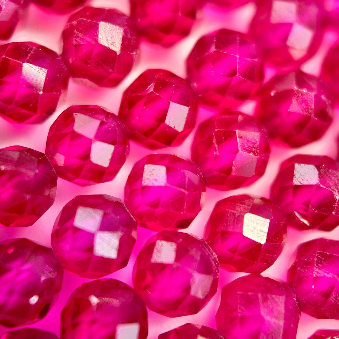 Synthetic ruby faceted round beads with vibrant red color for jewelry making