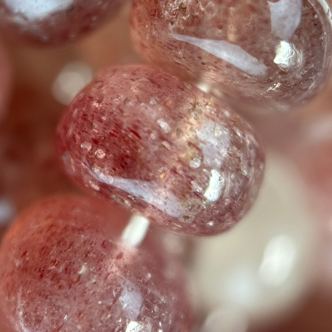 Natural quartz varieties including clear quartz, rose quartz, amethyst, citrine, smoky quartz and rutilated quartz.