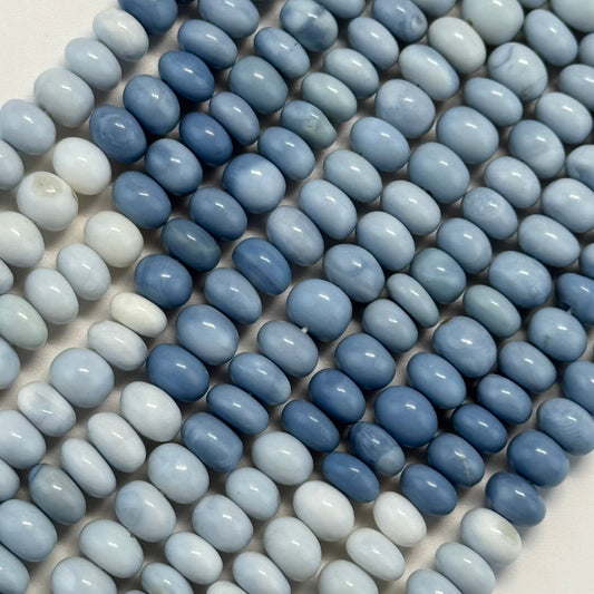 Natural precious opal displaying multicolor play-of-color across the surface of the gemstone.