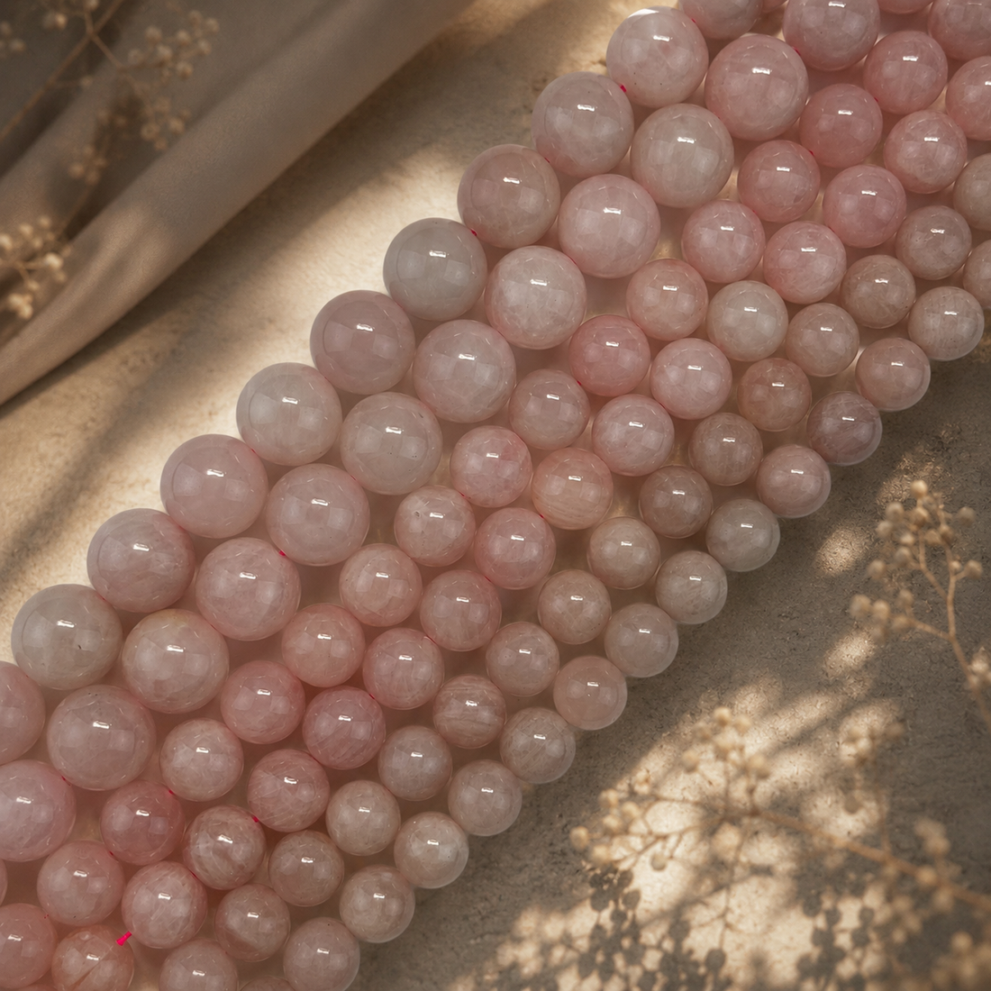 Natural quartz gemstone varieties including clear quartz, rose quartz, smoky quartz, amethyst, citrine, and rutilated quartz