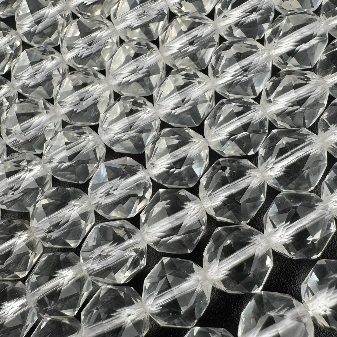 Natural quartz crystals showing clear, purple, pink, smoky and included quartz varieties from the quartz gemstone family.