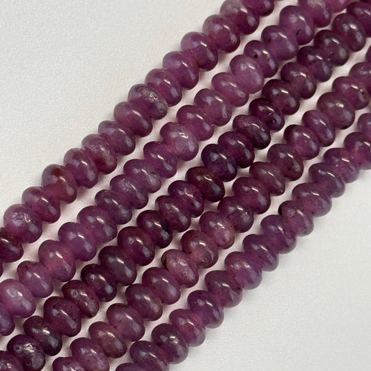 Natural red ruby corundum gemstones showing variations in red color, transparency, and natural inclusions.