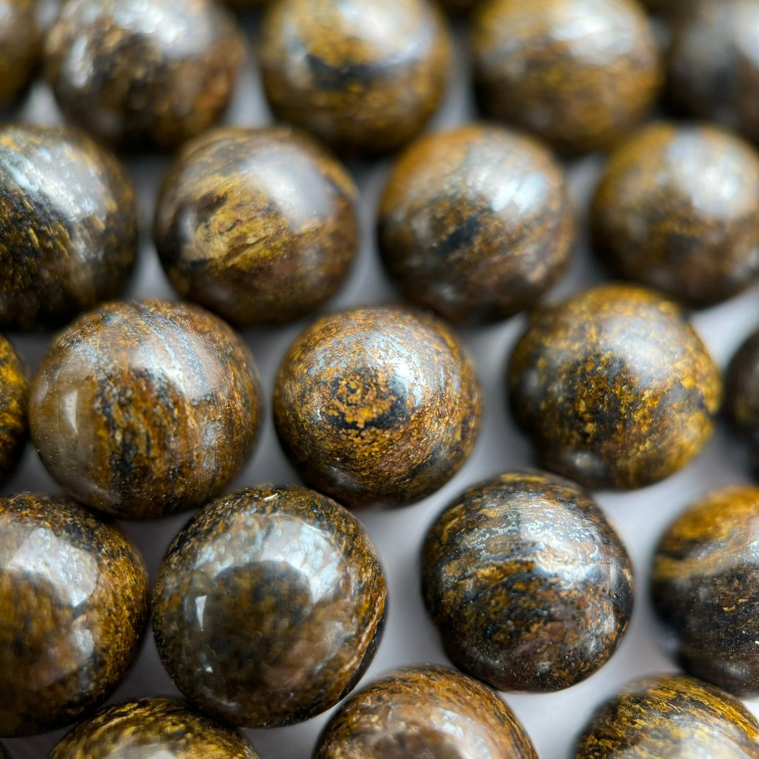 Natural Bronzite gemstone beads in warm bronze-brown tones with metallic shimmer for bracelet making, necklaces, earrings, and custom jewelry designs