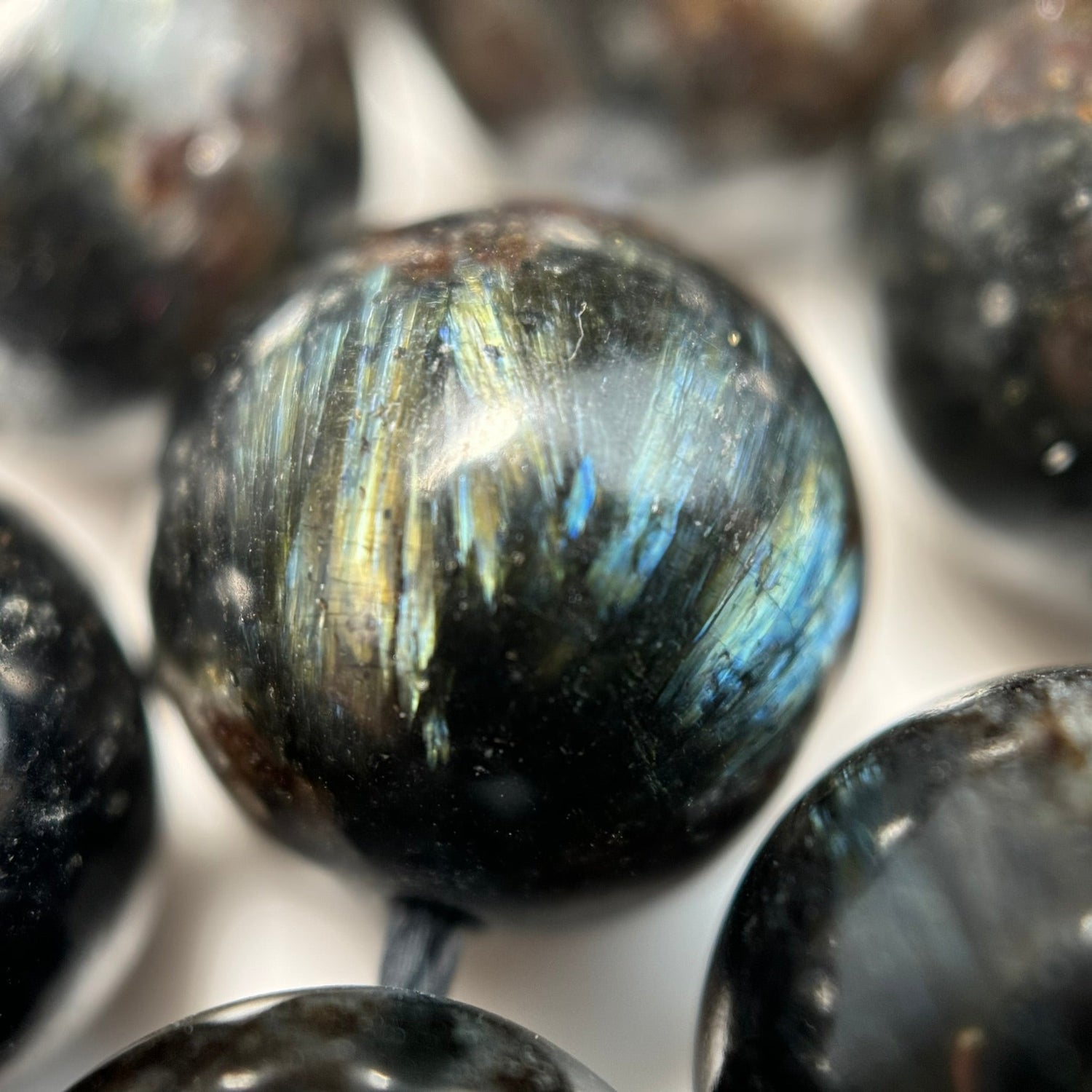 Natural Arfvedsonite gemstone beads in dark blue-black tones with subtle shimmer for bracelet making, necklaces, earrings, and custom jewelry designs
