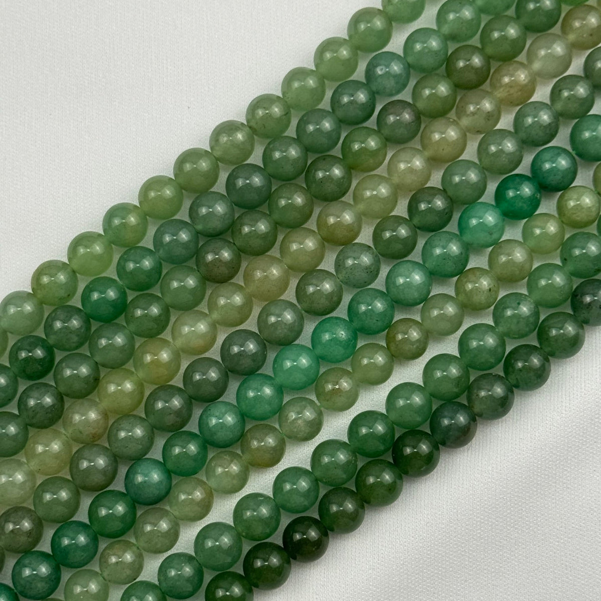 Natural Aventurine gemstone beads in multiple sizes for jewelry making by Reza Gem Collection.