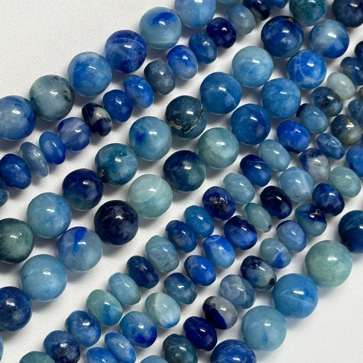 Natural Afghanite gemstone beads in various sizes for jewelry making and bracelet design by Reza Gem Collection.