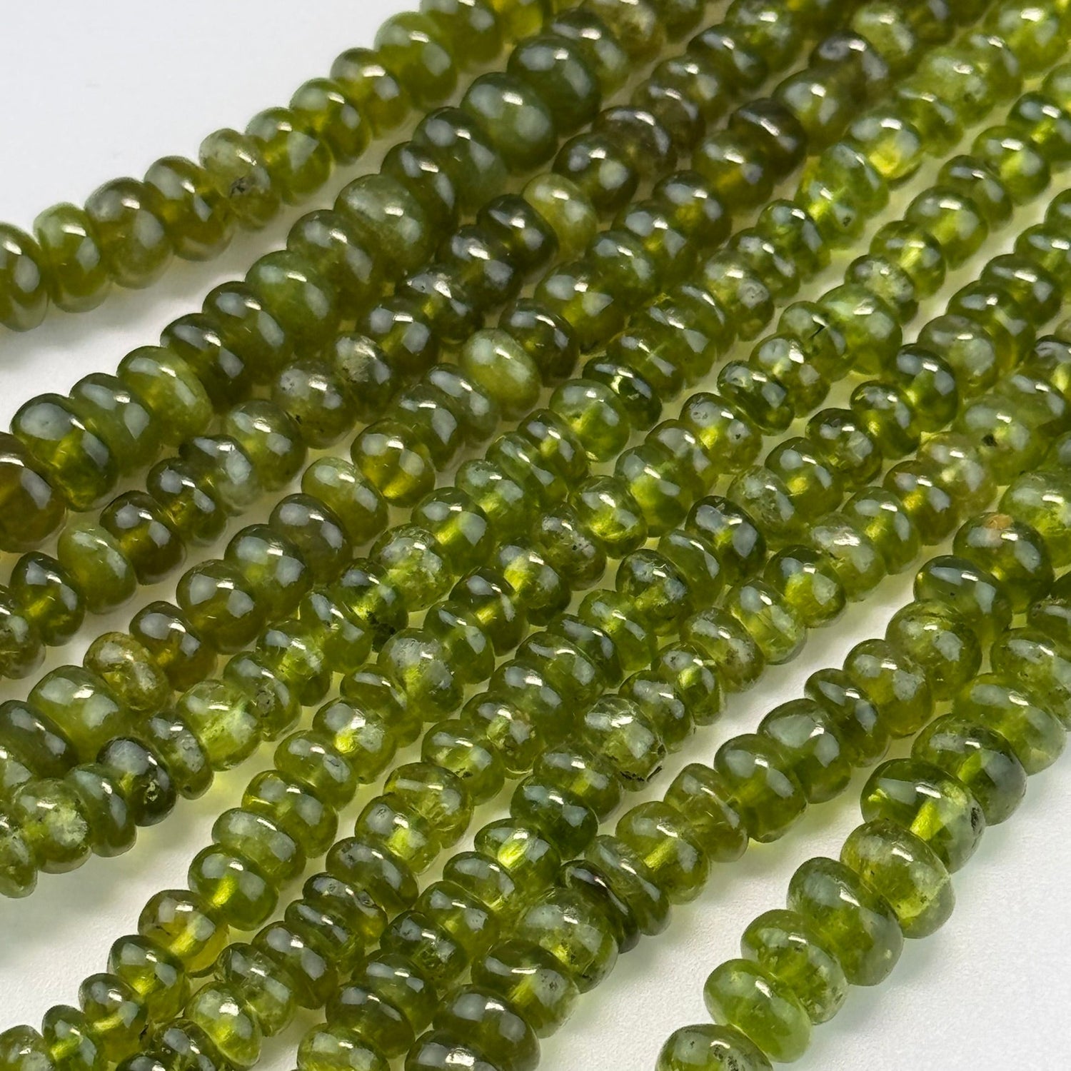 Natural Vesuvianite gemstone beads for jewelry making and bracelet design by Reza Gem Collection.