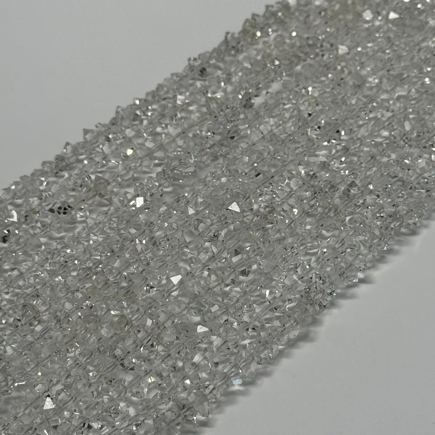 Natural diamond-cut gemstone beads in multiple stones and sizes for jewelry making by Reza Gem Collection.