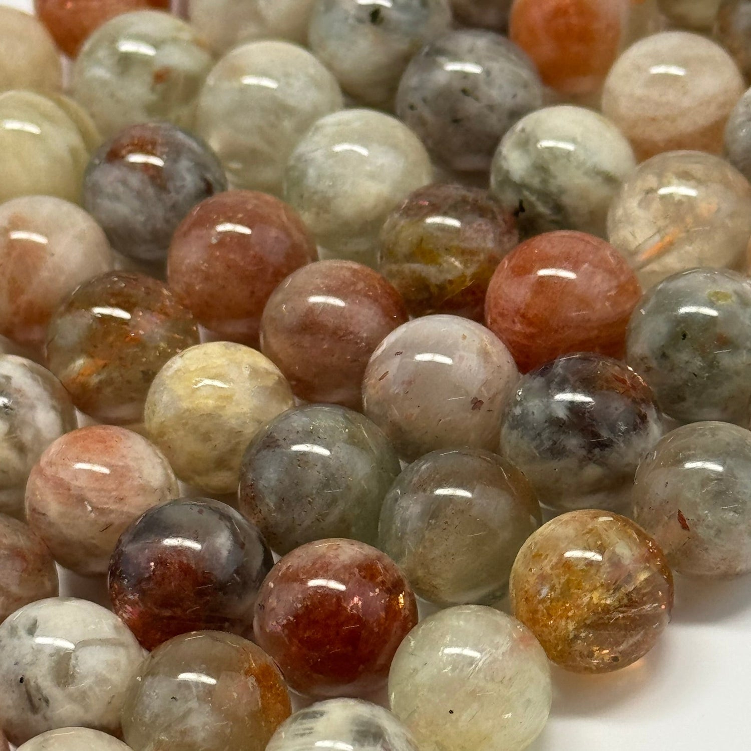 Natural Arusha gemstone beads in warm peach, orange, and golden tones for bracelet making, necklaces, earrings, and custom jewelry designs