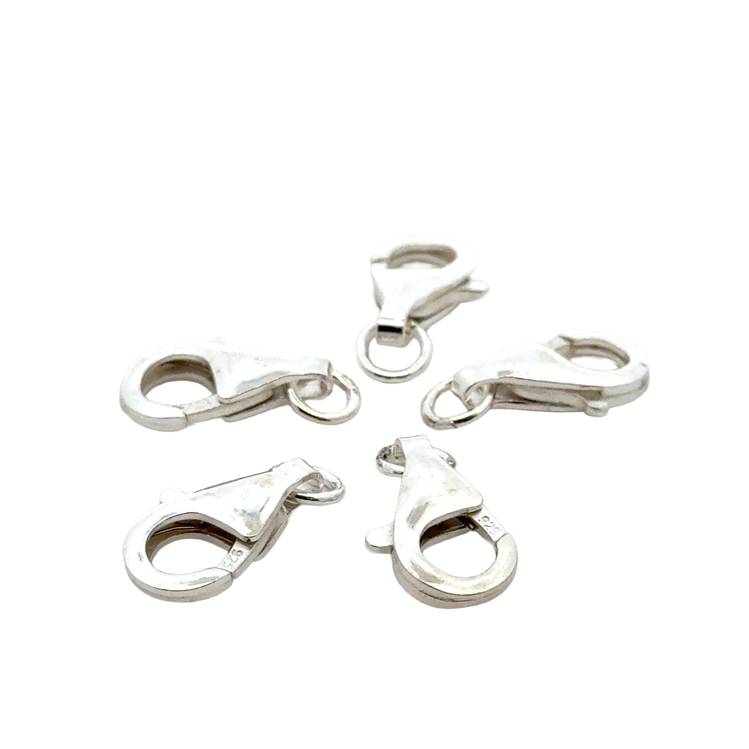 Jewelry findings and supplies including clasps, elastic cord, spacer beads, jump rings, and jewelry making components