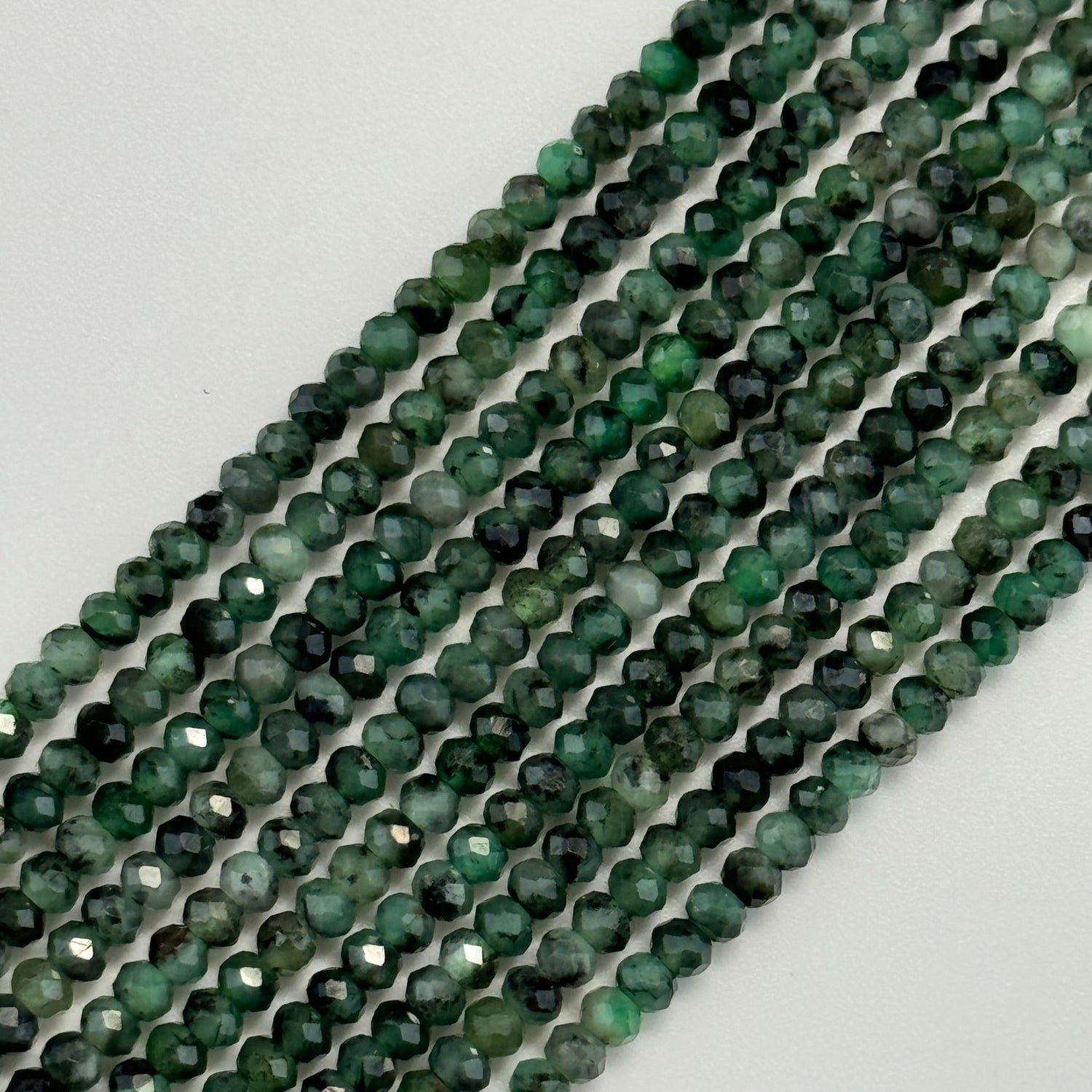 Trending gemstone beads and jewelry including emerald beads, fossilized coral beads, natural gemstone bracelets, crystal beads, and jewelry-making supplies.