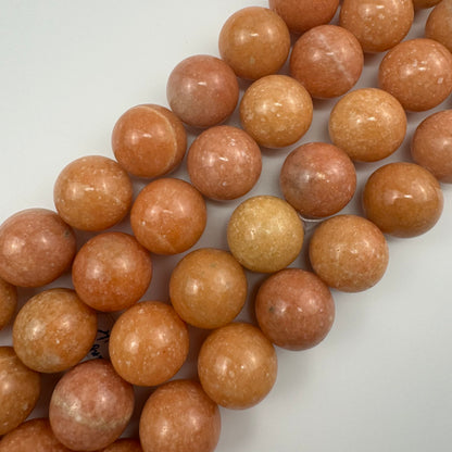 Orange Calcite Polished 20mm Round Beads image 0