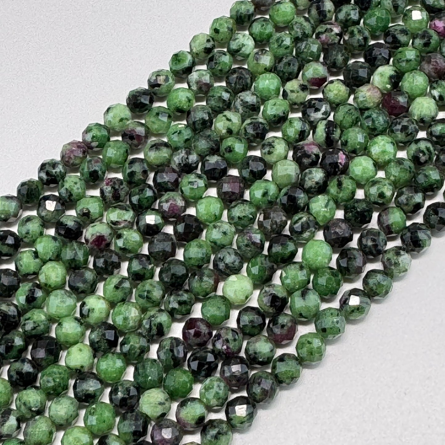 Ruby Zoisite Faceted Round Beads