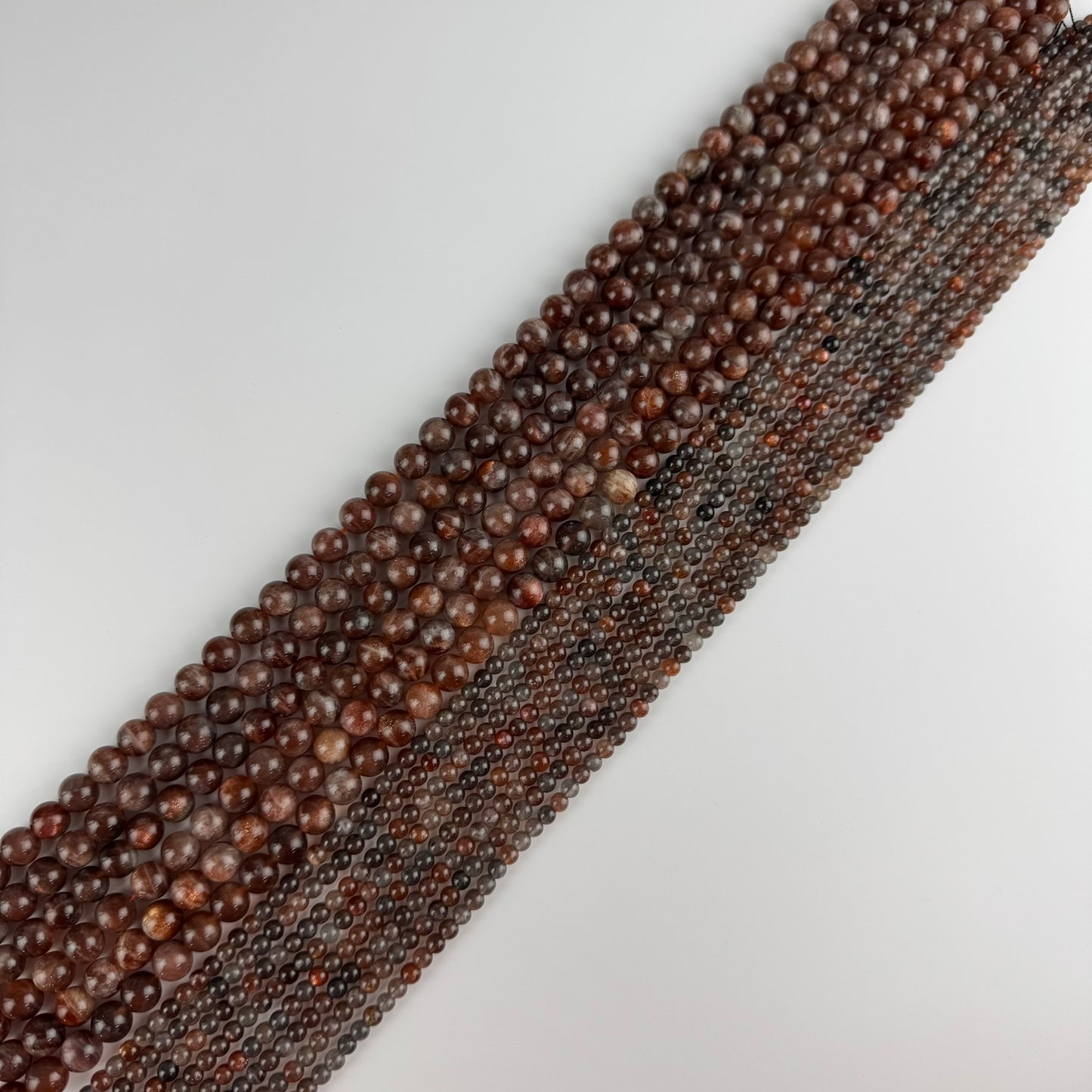 Burgundy Sunstone Polished Round Beads (AAA Quality)