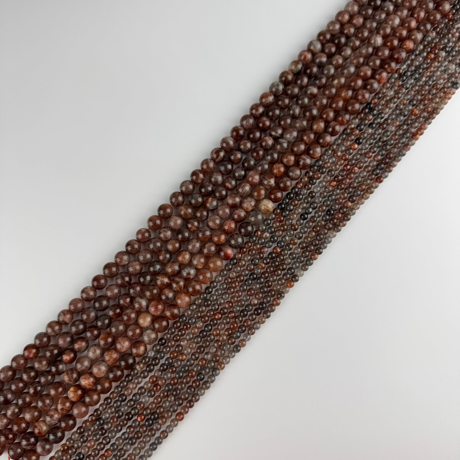 Burgundy Sunstone Polished Round Beads (AAA Quality)