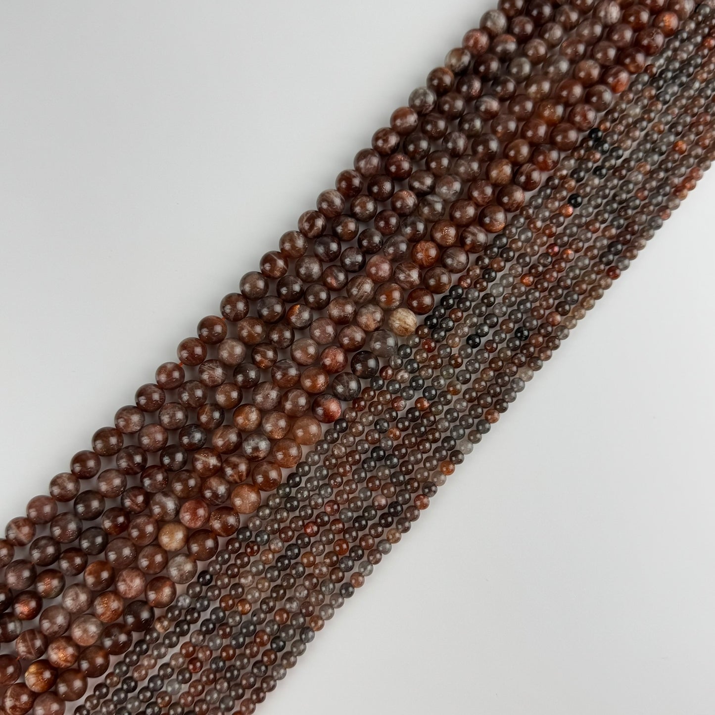 Burgundy Sunstone Polished Round Beads (AAA Quality)