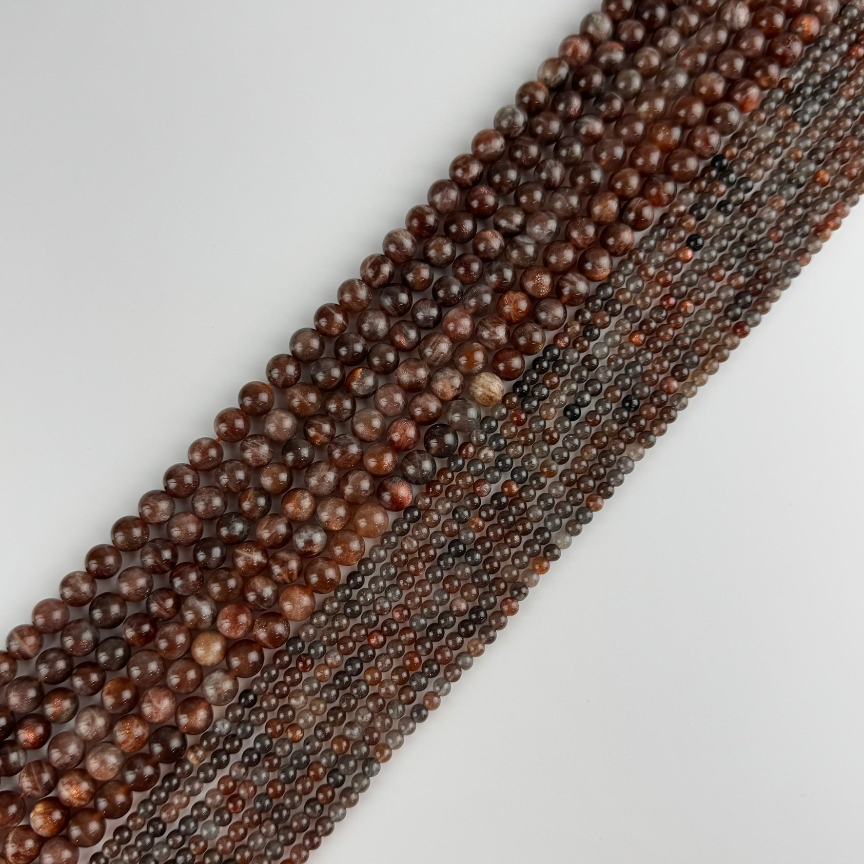 Burgundy Sunstone Polished Round Beads (AAA Quality)