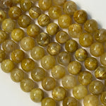 Golden Rutilated Quartz Polished Round Beads (AAAA Quality)