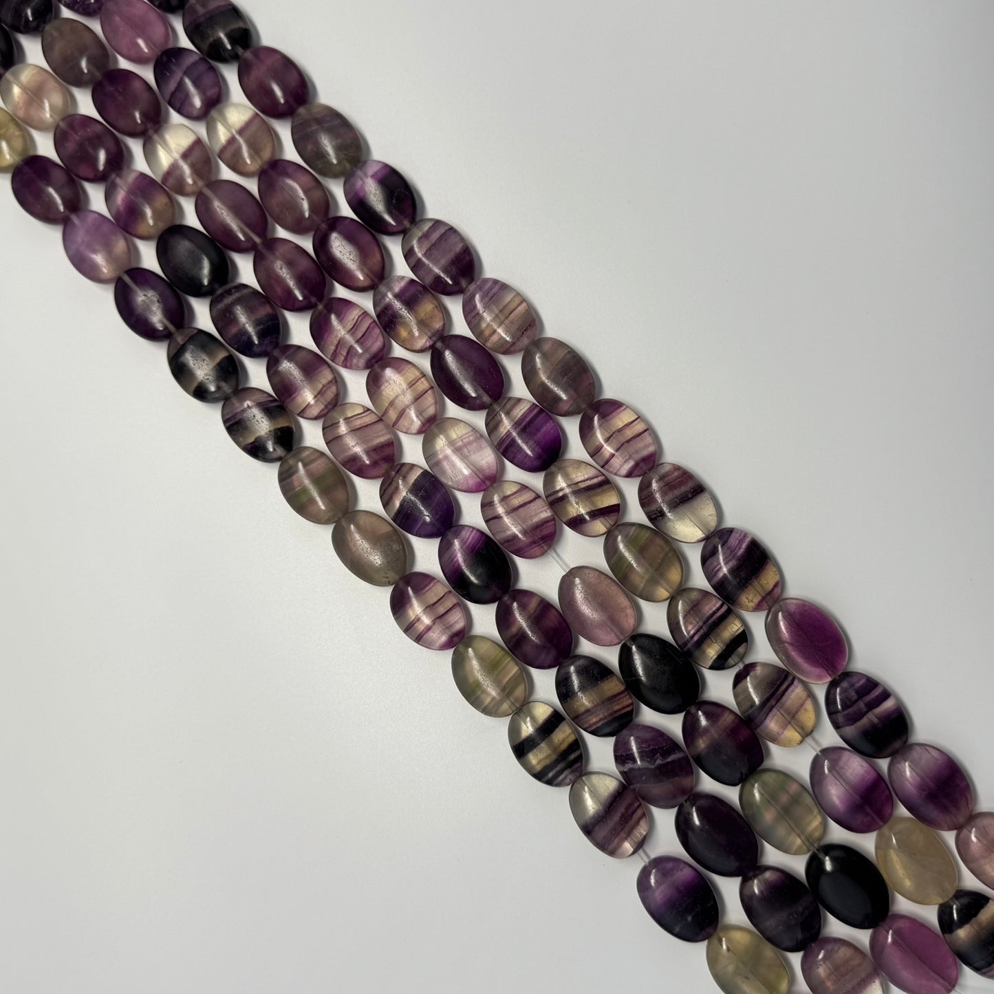 Rainbow Fluorite Polished Oval Gemsotne Beads - Purple Based