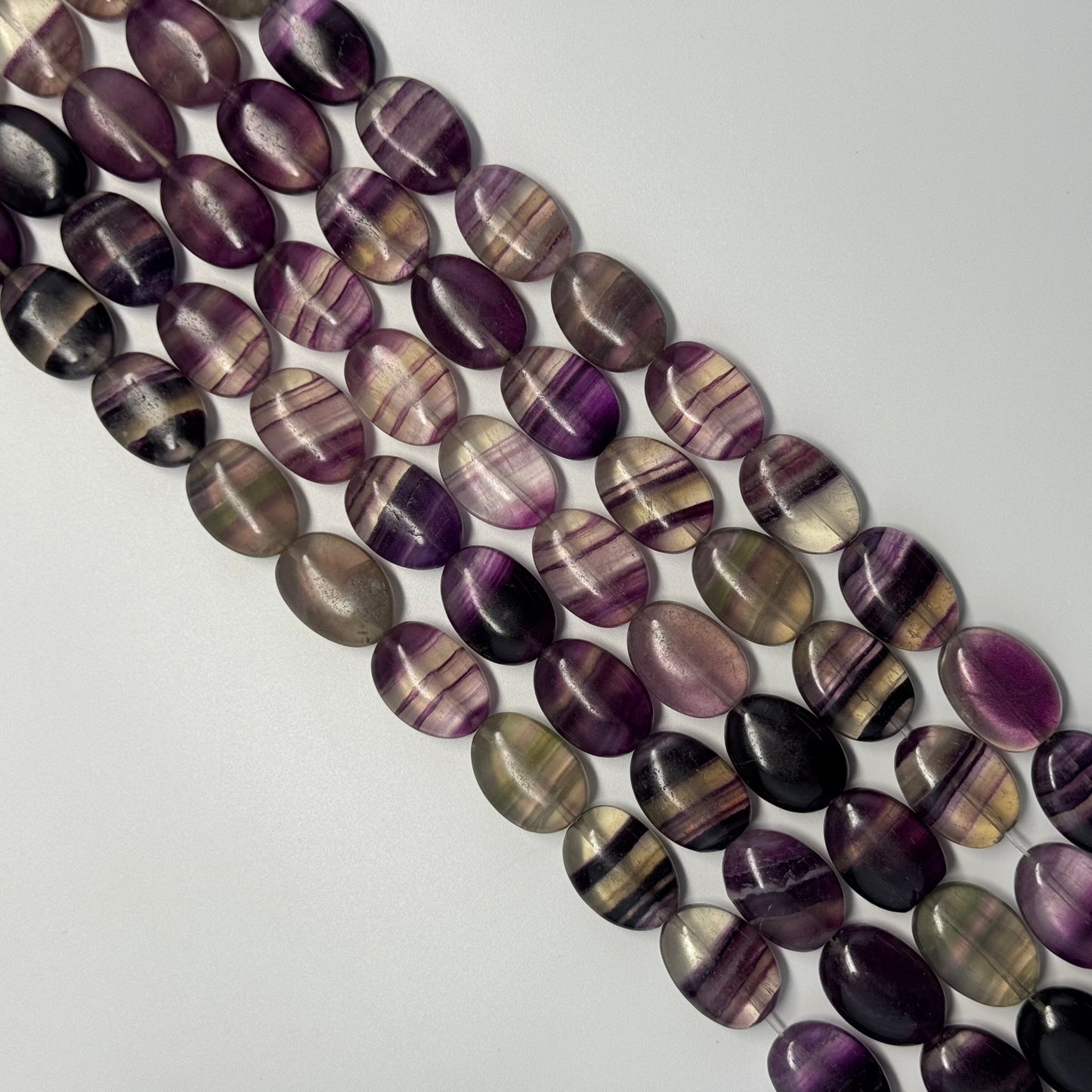 Rainbow Fluorite Polished Oval Gemsotne Beads - Purple Based