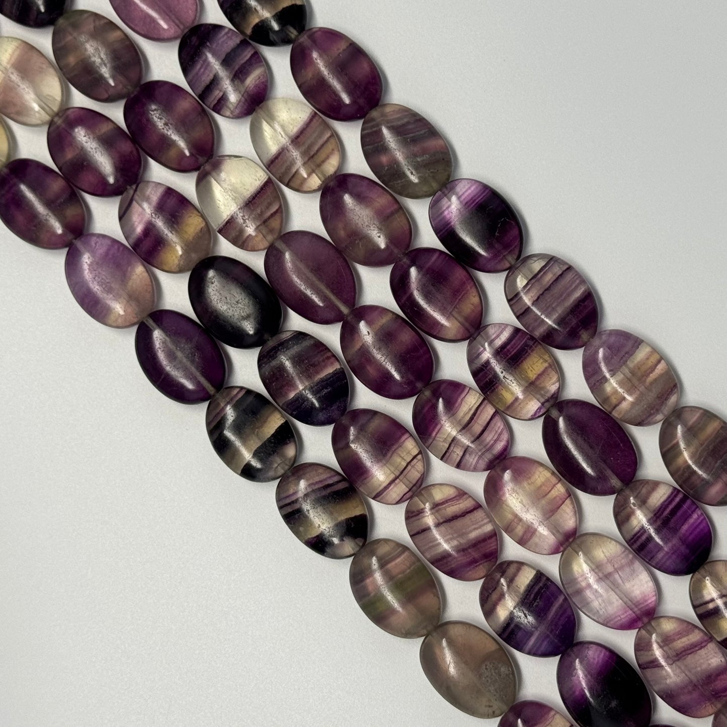 Rainbow Fluorite Polished Oval Gemsotne Beads - Purple Based