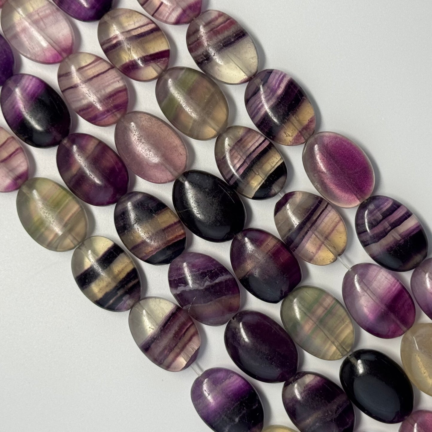 Rainbow Fluorite Polished Oval Gemsotne Beads - Purple Based