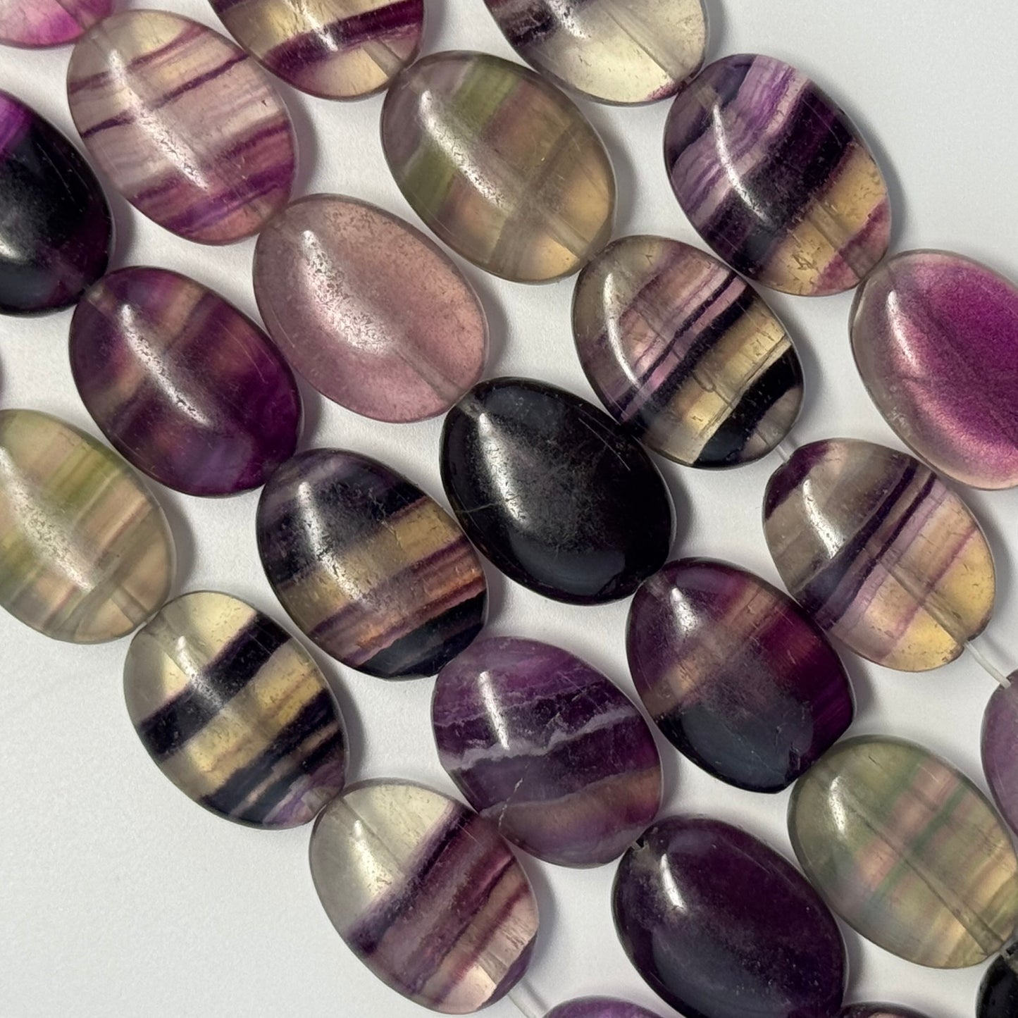 Rainbow Fluorite Polished Oval Gemsotne Beads - Purple Based