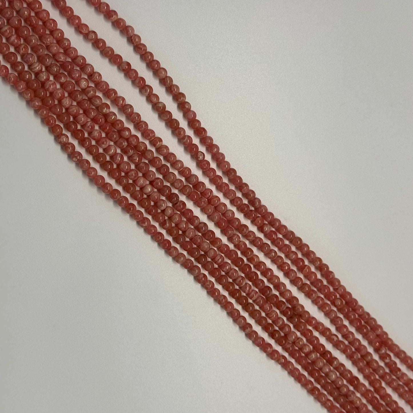 Rhodochrosite Polished Round Beads - (AAA Quality)