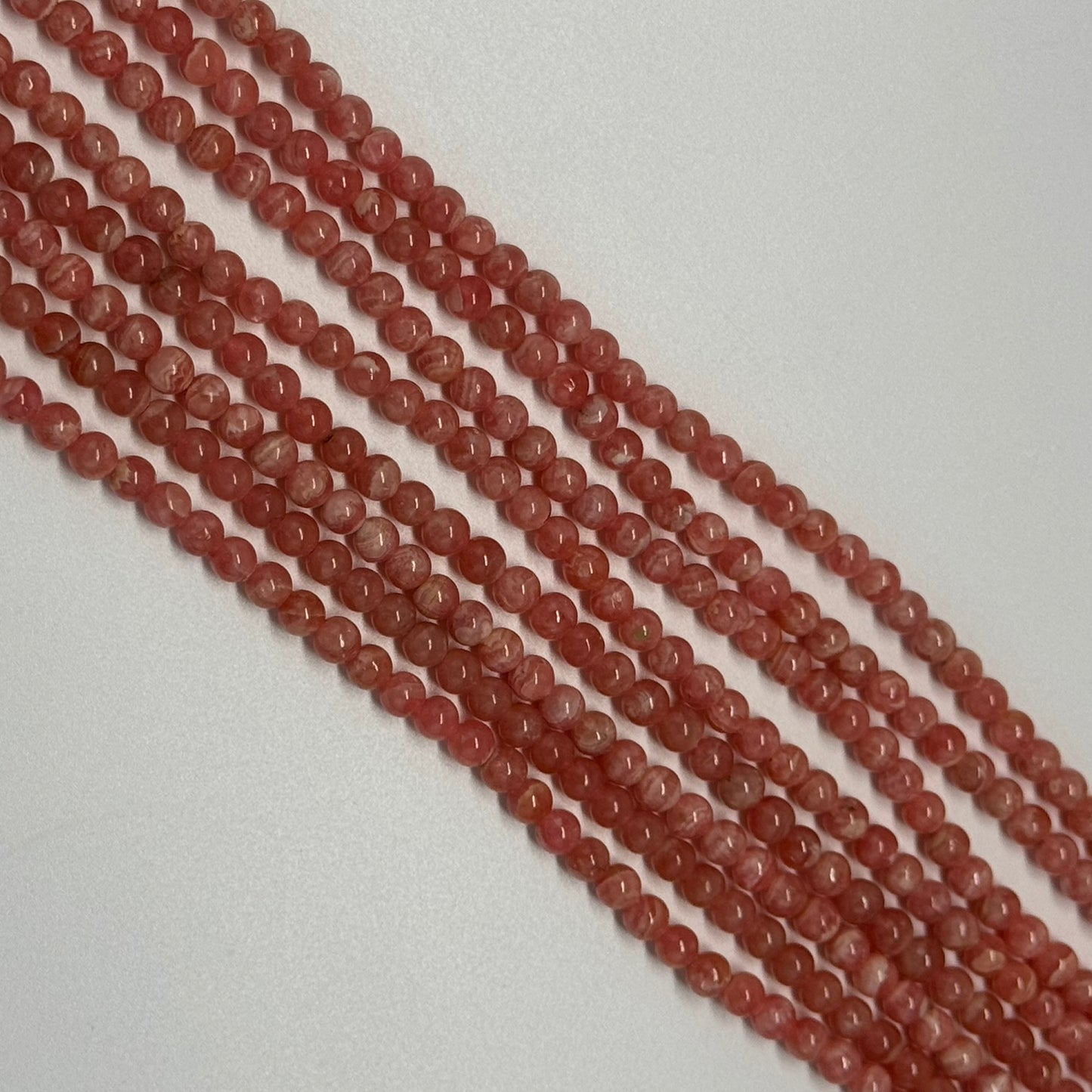 Rhodochrosite Polished Round Beads - (AAA Quality)