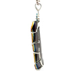 Titanium-Coated Druzy Pendant with Three Blue Zircons