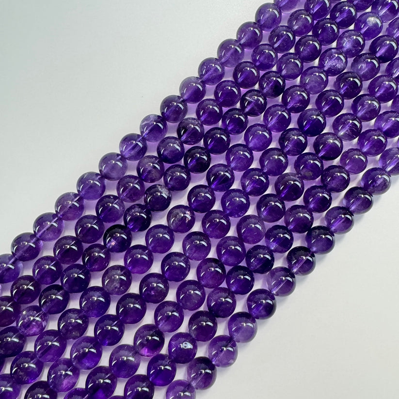 African amethyst in purple color, round shape and smooth finish
